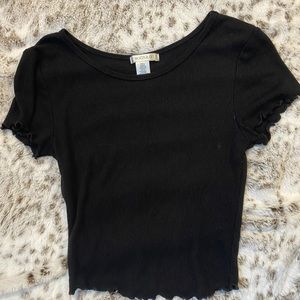 Plain black tee shirt with ruffles on the end